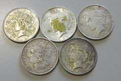 4 PEACE DOLLARS AND $1 MORGAN POLITICAL STICKER ON BACK OF 1