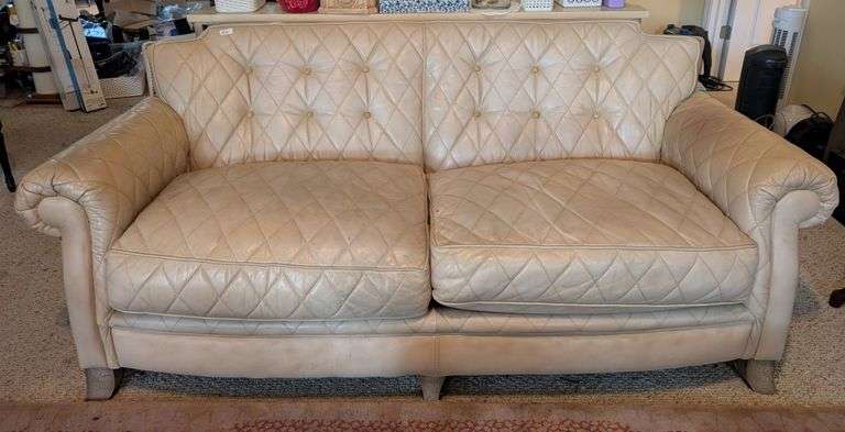 Cream colored tufted leather sofa, 81"x40"x38" tall, some marks on cushions, see pics(located in liv