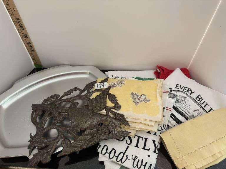 Lot of towels/tablecloth and tray (located in kitchen)