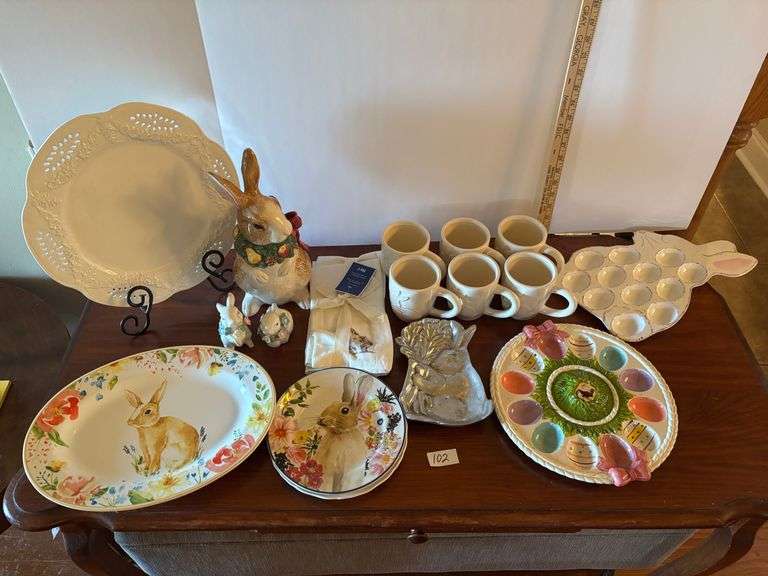 17 pc Easter lot, plates, platters, mugs, egg trays, etc. Stand not included (located in ds back roo