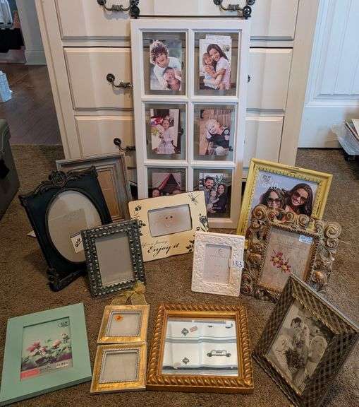 12 pc picture frames and mirror(located in ds back bedroom)