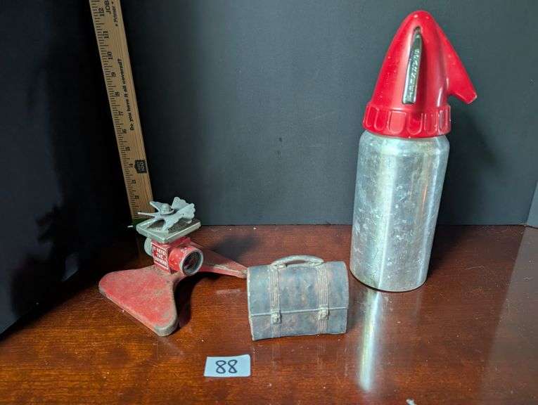 3 Vintage pcs. Sprinkler, Sparklet metal seltzer bottle, paperweight lunchbox(Located in ds back bed