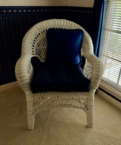 White wicker chair with navy cushion 28" wide x 35" tall (located in navy bedroom)