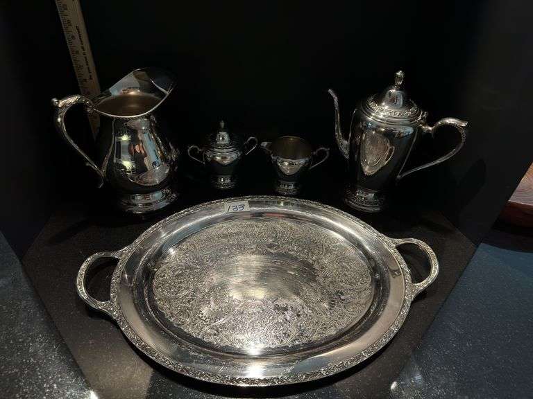 Silver plated coffee/tea service set includes pitcher (located in dining room)