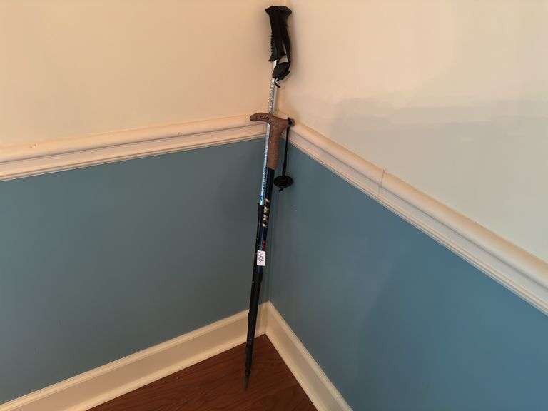 Pair of walking sticks (located in dining room)
