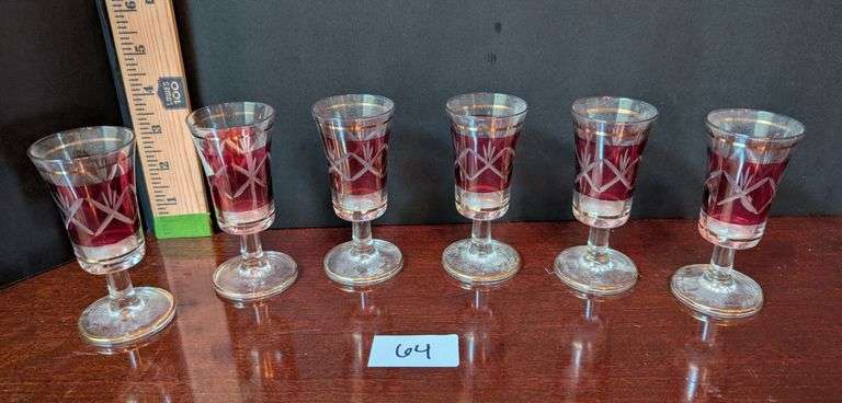 6 pc. Ruby Red gold trimmed cordial glasses(located in dining room)