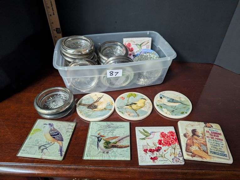 Small tote full of various designs coasters(located in ds back bedroom)