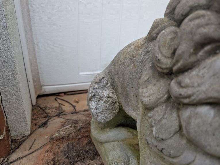 Lion statue, 10"x19"x22" tall, damage on leg(located outside garage)