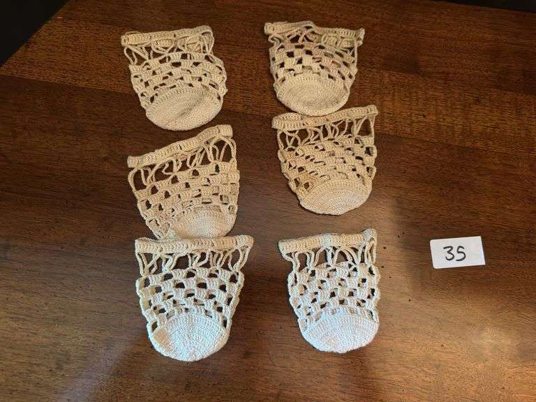 Vintage lace baby bonnet and 6 crochet high ball coasters (located in drawer in china cabinet)