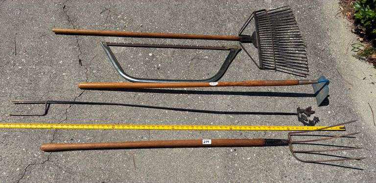 5 pc Bow Saw, Pitch Fork, Hoe and More (Located Garage)