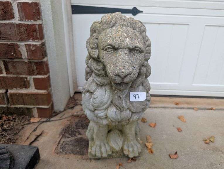Lion statue, 10"x19"x22" tall, damage on leg(located outside garage)