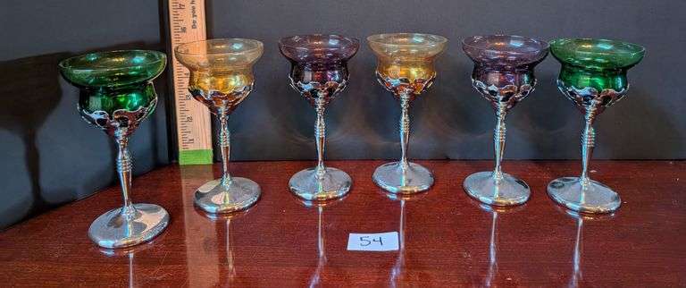6 pc. Multi color chrome and glass cocktail stems(located in dining room)