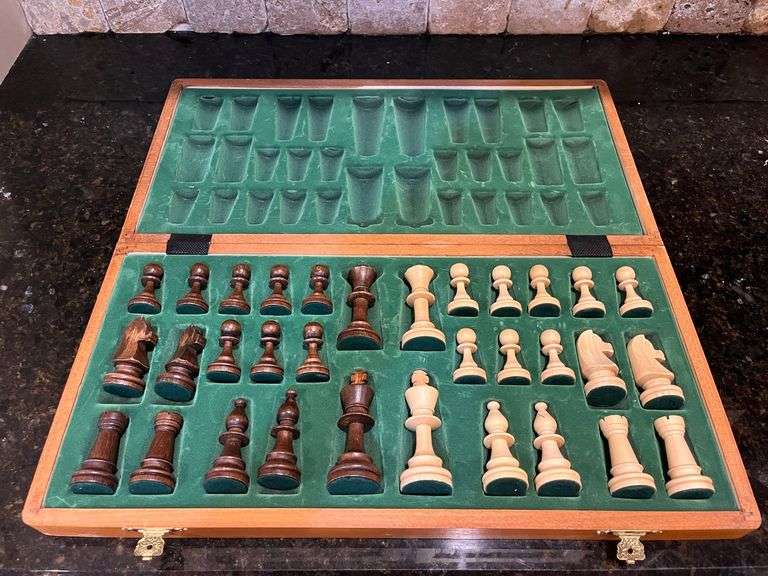 Wooden chess set: board w/ storage and all pieces (located in kitchen)