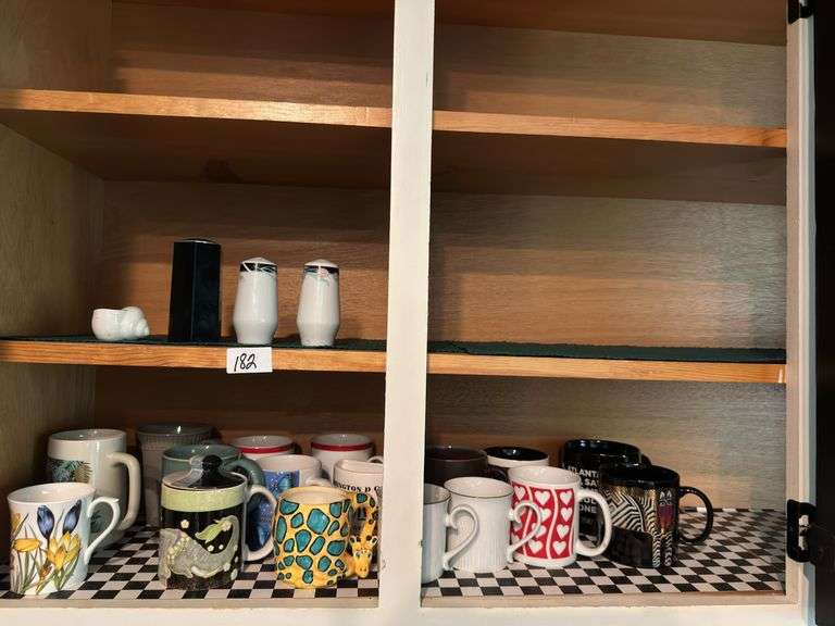Lot of 16 mugs, salt and pepper shaker)located in kitchen )