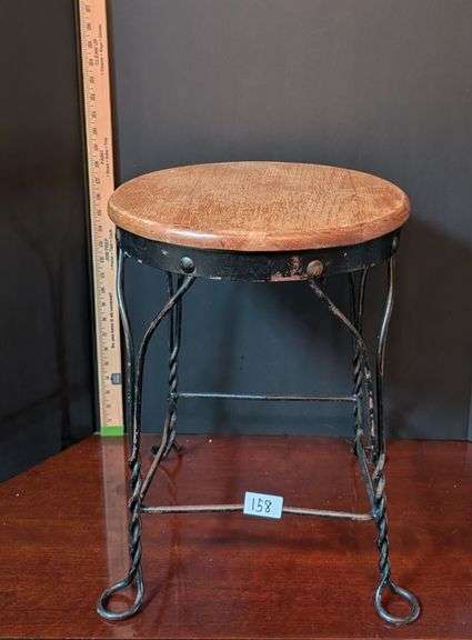 Twisted wrought iron stool wood top(located in DS back bedroom)