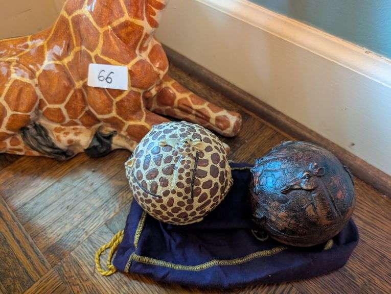 2 pc. Ceramic giraffe, 17" tall and carved wood decorative orbs(located near front door)