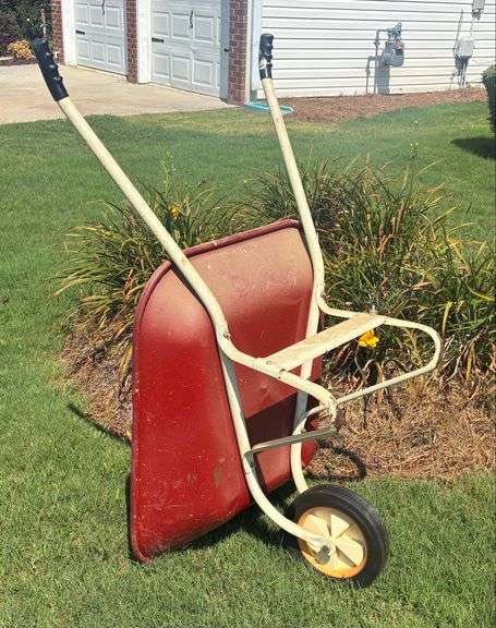 Red and White Wheel Barrow (Located Garage)