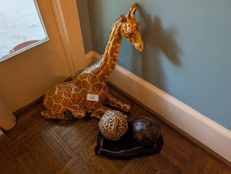 2 pc. Ceramic giraffe, 17" tall and carved wood decorative orbs(located near front door)
