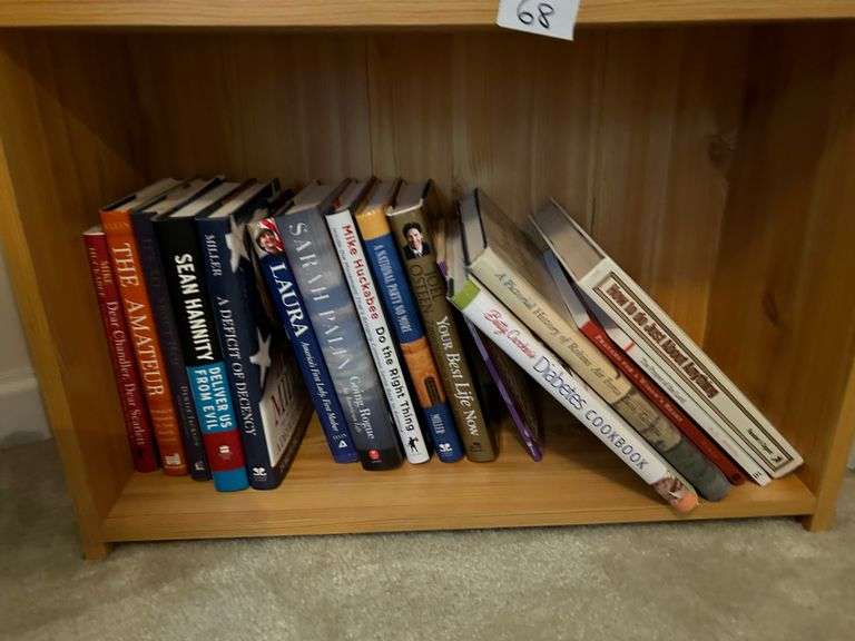 2 Shelf Lot of Books and Crossword Puzzle Books (Located in Bedroom to the Right)