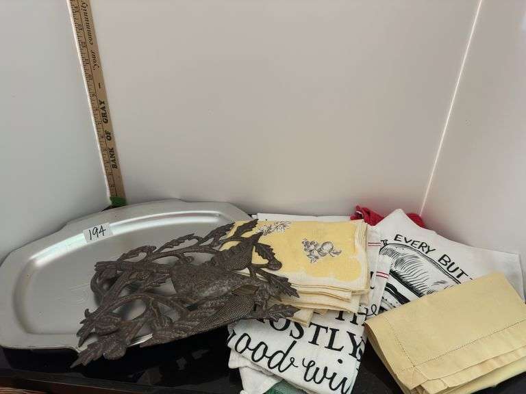 Lot of towels/tablecloth and tray (located in kitchen)