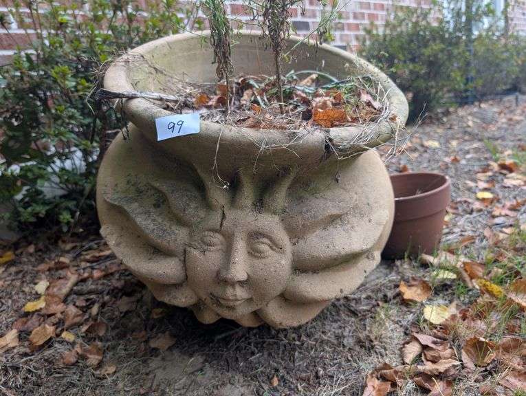 Large sun design cement planter 17" diameter 18" talland small terracotta planter(located on side of
