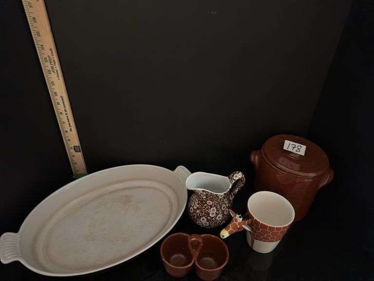 Pottery crock and condiment caddy, giraffe mug, pitcher and casserole dish (located in kitchen)