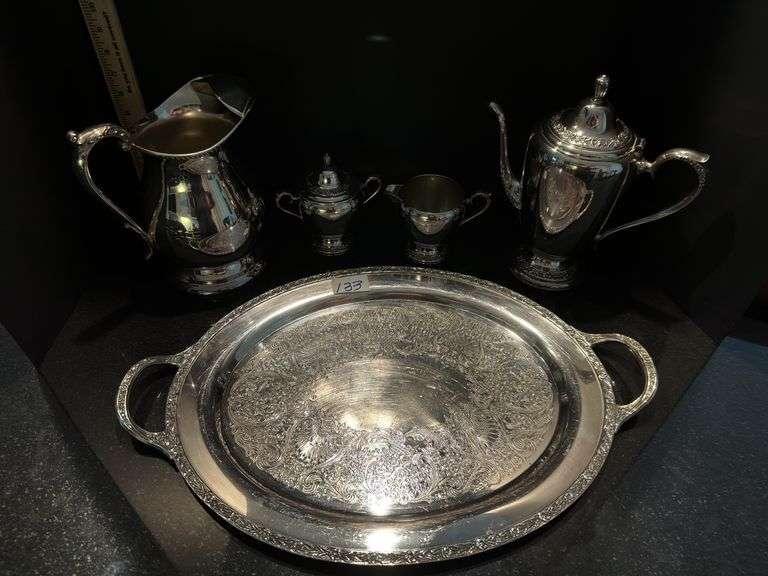 Silver plated coffee/tea service set includes pitcher (located in dining room)