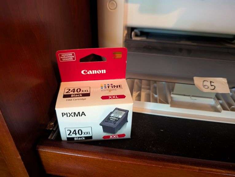 Canon printer with black ink cartridge(located in living room)