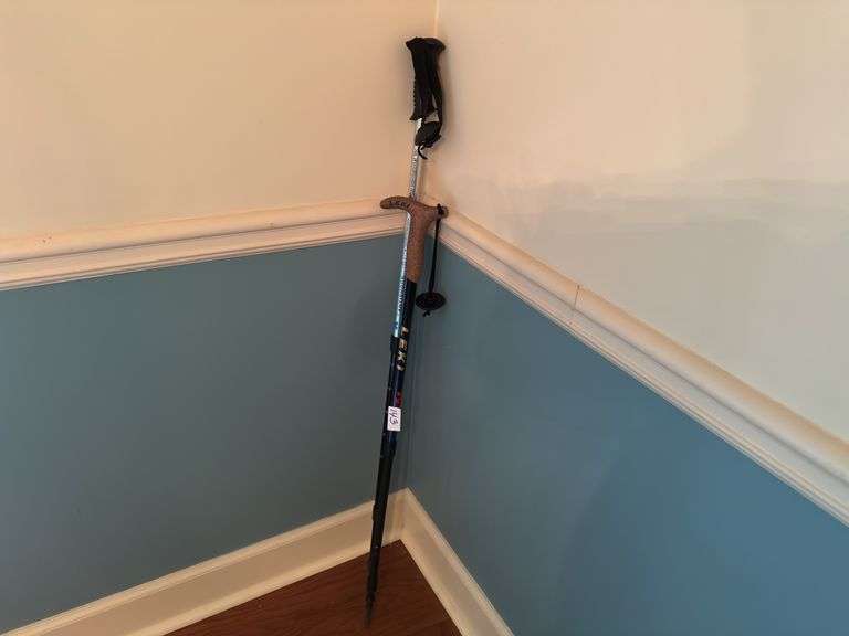 Pair of walking sticks (located in dining room)