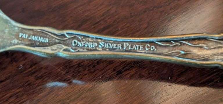 5 pc. Silver plated items, including Oxford silver Plated Co. Spoon(located in dining room)