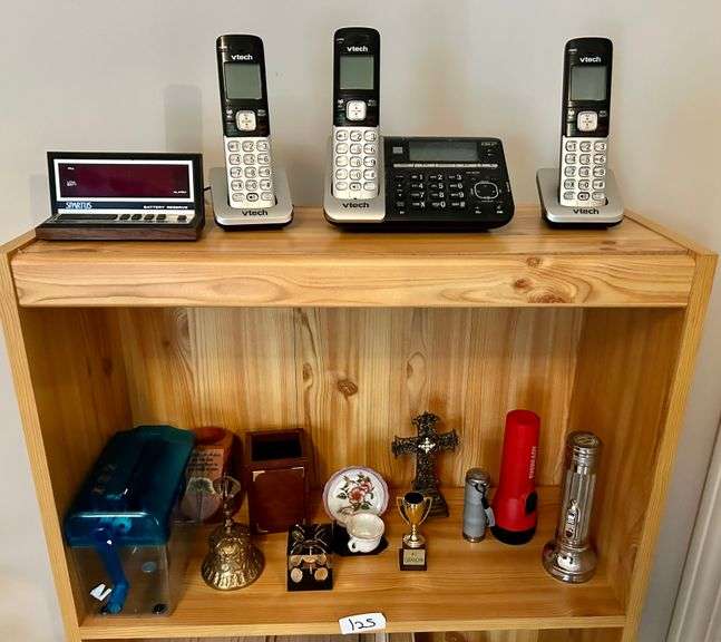 2 Shelf Lot of Phones, Flashlights and More (Located in Bedroom to The Right)