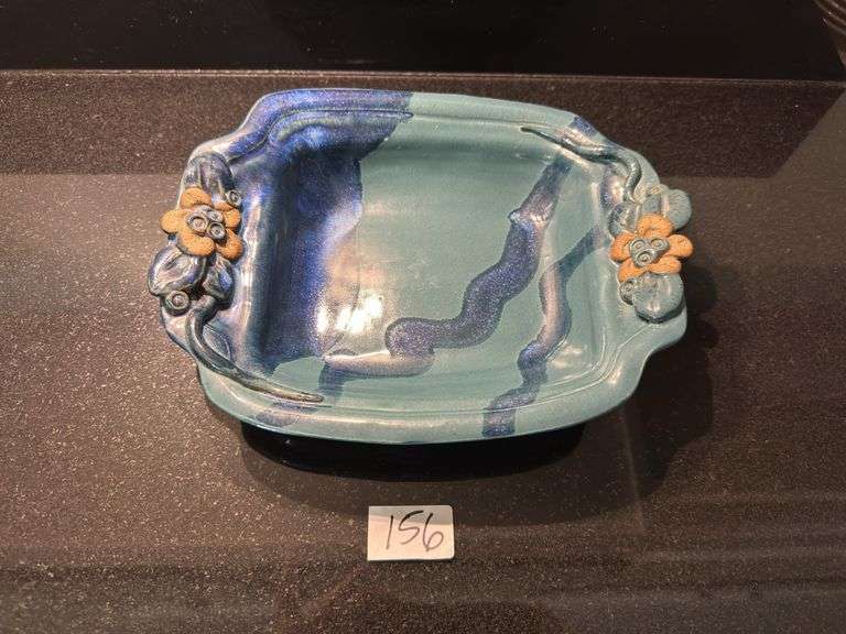 Palms up pottery dish, large ramekin, pair of square trays (located in kitchen)