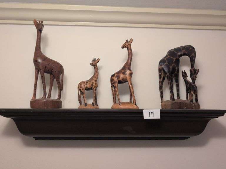 5pc. Shelf, 24" long with hand carved wooden giraffes from Kenya, tallest giraffe 7" tall (hallway)