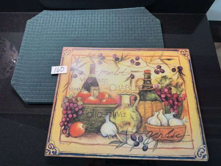 Set of 4 hunter green placemats, glass decorative trivet, pizza pan and cutter (located in kitchen)