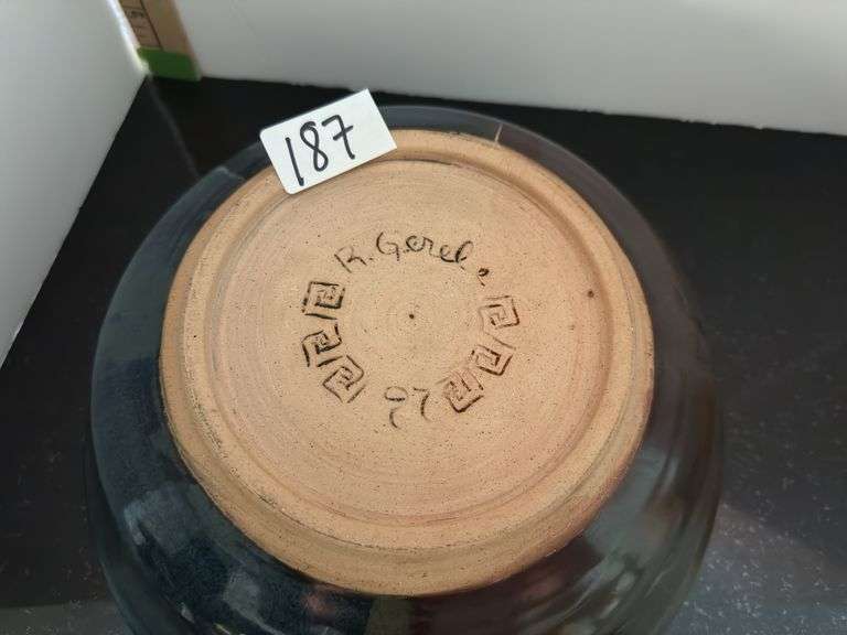Pottery bowl and pottery covered casserole (located in kitchen)