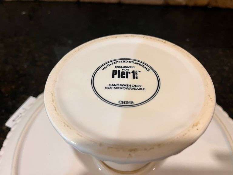 4 pc ”Fresh N’ Fruity” baking dishes and 10” Pier 1 Imports cake stands (located in kitchen)