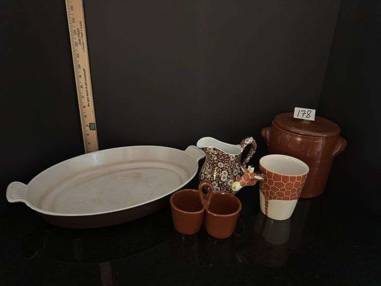 Pottery crock and condiment caddy, giraffe mug, pitcher and casserole dish (located in kitchen)
