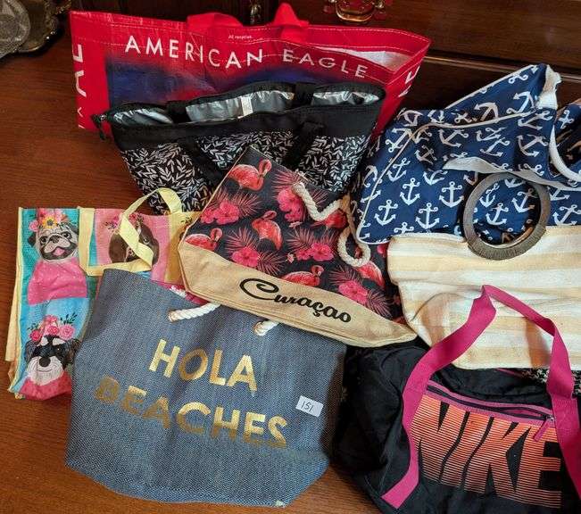 10 pc. Nike duffel bag, igloo bag, and tote bags (located in DS back bedroom)
