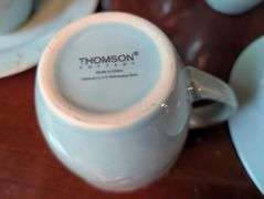 16 pc. Thomson pottery coffee cups and plates(located in dining room)