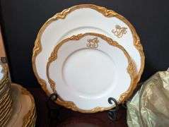 16 pc. Lorenz Hutschenreuther plates, made in Germany, with 3 storage bags(located in dining room)st