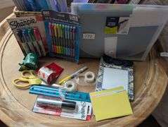Basket of office supplies(located in DS front bedroom)
