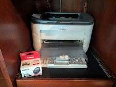 Canon printer with black ink cartridge(located in living room)
