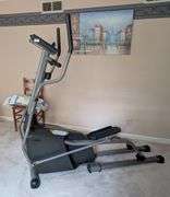 Horizon Fitness Elliptical machine, turns on, 68"x30"x 64.5"tall(located in upstairs bedroom)