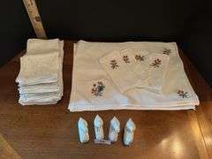 Napkins, place mats and napkin rings ( located in drawer in china cabinet)