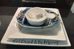 Palms up pottery dish, large ramekin, pair of square trays (located in kitchen)