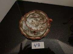 Japanese tea cup and saucer, tea pot, candlesticks and more (located in dining room)