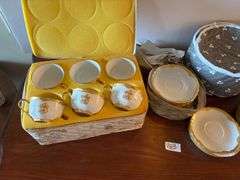 White and Gold Dish Set with Protective Packing Cases. Not a full set. (located in ds back room)