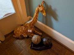 2 pc. Ceramic giraffe, 17" tall and carved wood decorative orbs(located near front door)