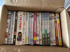 Box of DVDs, Mamma Mia!, Titanic, etc. (Located in ds back room)