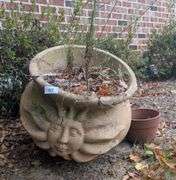 Large sun design cement planter 17" diameter 18" talland small terracotta planter(located on side of